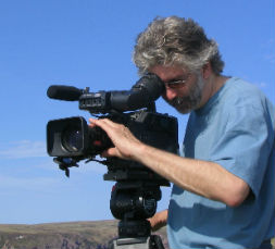 Cameraman Chris Murphy shooting whales and icebergs on the Bacclieu Trail in Newfoundland